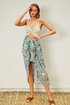 Indulge in your Moroccan dreams with our Sunrise Vacay Skirt! Featuring a stunning print and a flattering ruching effect, this satin skirt will be the center of attention on your next vacation. The full elastic waistband ensures a comfortable fit, while the unique design adds a touch of elegance to your wardrobe. PRE-ORDER 06/14/24 Fabric & fit: 100% rayon Model is wearing size small. Summer Rayon Skirt For Vacation, Vacation Rayon Midi Skirt, Vacation Midi Rayon Skirt, Rayon Midi Skirt For Vacation, Bohemian Ruched Bottoms For Summer, Summer Rayon Gathered Skirt, Summer Gathered Skirt In Rayon, Summer Vacation Rayon Skirt, Vacation Rayon Bottoms With Lined Skirt