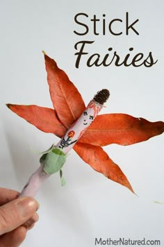 a person holding a toothbrush in front of a sign that says stick fairiess