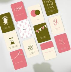 the cards have different designs on them and are pink, green, brown, and white