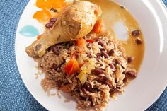 a white plate topped with rice and beans