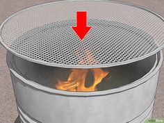 a fire pit with a red arrow pointing up at it's top and bottom