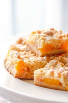 three pieces of cake sitting on top of a white plate