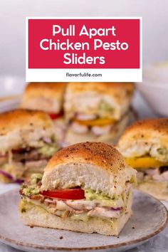 two halves of a chicken pesto slider on a plate with the text overlay that reads, dull apart chicken pesto sliders