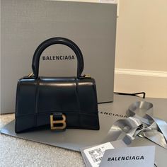 This Has Been Used Maybe Five Times At Most! Perfect Condition! See All Pictures. Never Used Long Strap. Long Strap Included And Box And Balenciaga Bag I Can Ship Too. Picture Of Receipt Can Be Provided Upon Request. Was Purchased At Saint Laurent In Galleria Mall In Houston. Will Be Authenticated By Posh! Ships Same Day Balanciaga Bag, Balenciaga Mini Bag, Balenciaga Aesthetic, Balenciaga Store, Galleria Mall, Daily Aesthetic, Bags Balenciaga, Expensive Bag, Maroon Nails