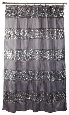 a shower curtain with silver sequins on the bottom and black trim around it