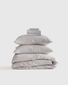 a stack of pillows sitting on top of each other