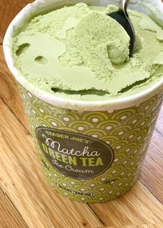 green tea ice cream in a cup with a spoon