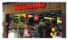 the storefront for waldebooks is decorated with balloons