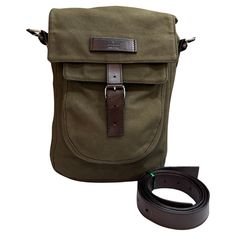 This GUCCI messenger bag is crafted of green canvas and brown cowhide leather featuring black chome toned hardware. Front flap buckle closure opens to a brown monogram jacquard interior with a zippered pocket. This messenger bag also features a front flap pocket with velcro closure. Made in Italy. Measures approximately 8.5 x 12 x 3 inches Strap drop 24 inches at its longest with 5-hole adjustment on each side (can punch additional holes if needed). Comes with dustbag and detachable leather strap. Condition - Fair vintage condition with some signs of wear Outside: Minor fading on canvas. Some cracks on leather trimmings and strap Inside: Minimal to no visible signs of wear Smell: No odor Gucci Messenger Bags, Gucci Style, Brown Cowhide, Canvas Messenger Bag, Gucci Fashion, Fashion Handbags, Vintage Gucci, Cowhide Leather, Cross Body Handbags