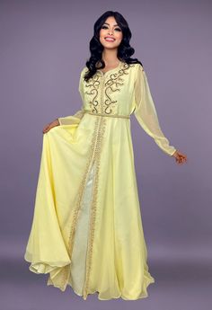 Caftan in yellow chiffon embroidered with pearls and gold threads. Belt delivered with the dress Bollywood Style Gold Kaftan For Festive Occasions, Gold Bollywood Kaftan For Festive Occasions, Gold Long Sleeve Gown With Zari Work, Gold Zari Work Long Sleeve Gown, Gold Bollywood Kaftan, Traditional Yellow Wedding Kaftan, Festive Floor-length Yellow Kaftan, Festive Gold Kaftan For Festive Occasions, Gold Festive Kaftan