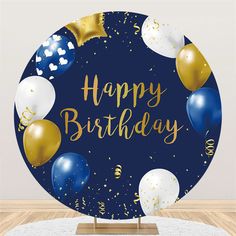 a happy birthday sign with balloons and confetti in the center on a wooden table