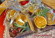 oranges and rosemary are wrapped in cellophane