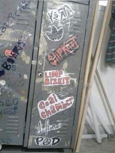 an old metal locker with graffiti on it