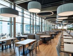 an empty restaurant with many tables and chairs