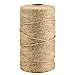 a roll of gold colored paper on a white background