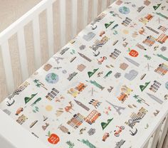 a crib sheet with an image of the city skylines and buildings on it