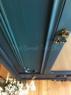 an overhead view of the door handle on a blue cabinet