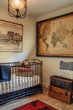 a map hangs on the wall above a crib in a child's bedroom