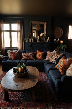 a living room filled with lots of furniture next to a window covered in curtains and pillows