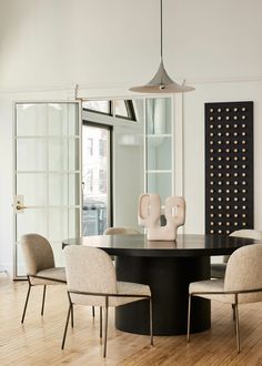 a dining room table with chairs around it