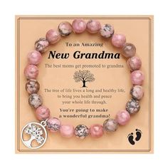 a pink beaded bracelet with a tree charm on it and an inspirational quote about new grandma