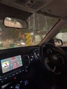 the interior of a car with dashboard lights and electronic display on it's screen