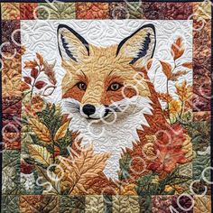 a close up of a quilt with a fox on it's face and leaves