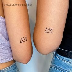 two people with matching tattoos on their arms, one has a crown and the other has a heart