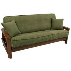 a green futon couch with two pillows on it's back and one arm