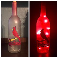 two bottles that have lights in them and one has a cardinals logo on the bottle