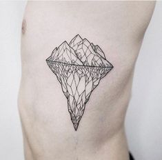 a black and white photo of a diamond tattoo