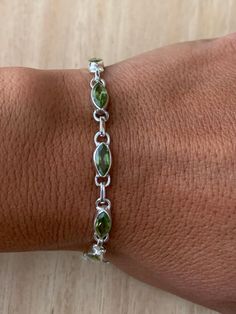 Lovely faceted peridot and sterling silver bracelet. The bracelet has 10 individual faceted peridot stones in marquise shape.  The bracelet measure 19.5 cm long and it is almost 0.5 cm wide. The bracelet can be  easily  adjusted from 19.5 cm to 18.5 cm.  The high quality of our stones is what it makes this bracelet so precious. The peridot is faceted to add the extra shining and elegance to the bracelet.  A perfect present for her on any occasion St Valentine Day, Birthday, Anniversary, or Chris St Valentine, Peridot Bracelet, Present For Her, Dope Jewelry, August Birthstone, Bracelet Chain, Classy Jewelry, Funky Jewelry, Jewelry Lookbook