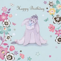 a happy birthday card with an image of a bunny sitting in the middle of flowers