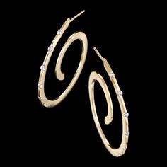 Spirale diamond earrings are timeless and chic. These unique and fashionable earrings feature diamonds set in 14kt yellow gold. Fashionable Earrings