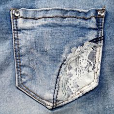 the back pocket of a pair of jeans with lace on it's bottom and side