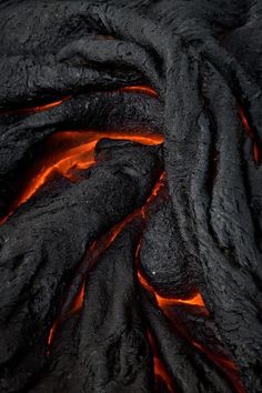 the lava is glowing red and orange as it moves through the air in this close up photo