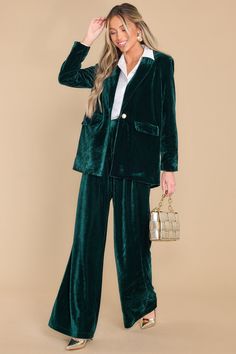 Becoming a Boss Babe has its perks. No one interrupts you in the meeting. someone else orders your coffee...and you get to make sophisticated fashion statements. like with this lovely dark green velvet blazer! This jacket features a collared neckline. one functional button at the waist. functional pockets at the waist. and a relaxed/oversized fit. Model is wearing an x-small. • 95% Polyester. 5% Spandex • Hand Wash Cold • Lined 100% Polyester • Imported Green Velvet Blazer, Christmas Wardrobe, Ruched Blouse, Dark Green Velvet, Sorority Rush Dresses, Sophisticated Fashion, Pleated Neckline, Rush Dresses, Cardigan Crop Top