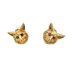 This is part of Chairish’s Fine Jewelry assortment.  A distinguished pair of vintage 14K gold post earrings, crafted in the likeness of fox heads. Each earring features prong-set, faceted ruby eyes. One earring bears the hallmark of J.E. Caldwell & Co. and 14K, while the other lacks a mark. It is likely that they were originally part of a stud set, given the slight differences between the heads. However, once worn, these differences are indiscernible. The condition is excellent.  Dimensions: Width: 1/2", Length: 3/8", Weight: 4.7 grams. Gold Fox, Fox Head, Stud Set, Prong Setting, Post Earrings, Hallmark, Bears, Ruby, Fox