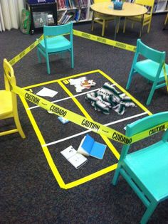 several children's chairs with caution tape taped around them