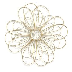 a gold metal flower wall decoration on a white background with the letter c in the center