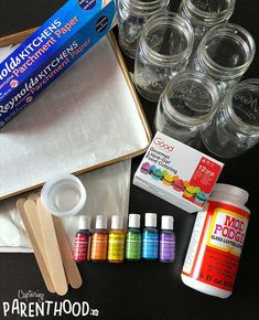 the supplies needed to make an art project include paint, glue and wooden spoons