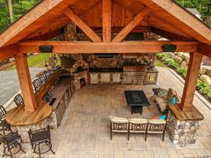 an outdoor kitchen and dining area is shown