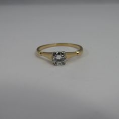 Estate vintage wedding engagement ring. 14k yellow gold. clean white 1/2 carat transition diamond. g color. clean quality stone vs1. looks good. 1.9 grams. will come with quality ring box. hallmarked with designer. Vintage Oval Diamond Ring With Single Stone, Heirloom Solitaire Wedding Ring With Round Band, Heirloom Solitaire Wedding Ring, Classic 14k Gold Diamond Ring, Classic Gold Cushion Cut Diamond Ring, Classic Gold Wedding Ring With Single Diamond, Vintage Yellow Gold Cushion Cut Diamond Ring, Classic White Engraved Ring With Round Band, Vintage Engraved Ring With Single Diamond For Formal Occasions