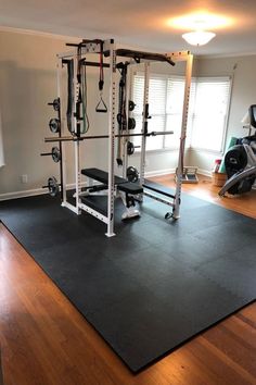 a home gym with exercise equipment in the corner