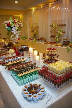 an assortment of desserts are displayed on a table