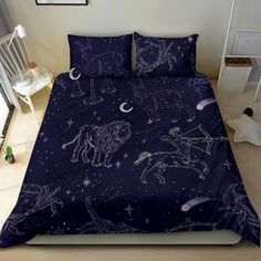 an image of a bed with unicorns in the night sky on it's comforter