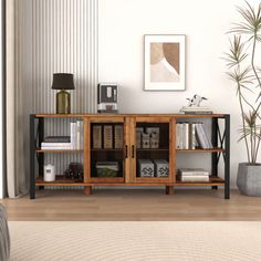 a living room scene with focus on the bookshelf and plant in the corner