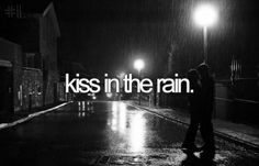 two people standing in the rain with an umbrella over their head and text that reads kiss in the rain