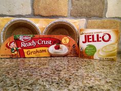 three packages of jello sitting on top of a counter