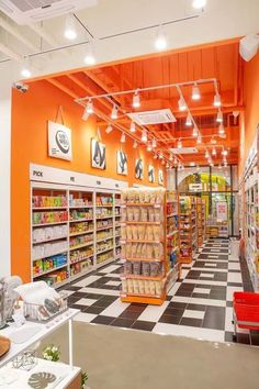 an orange and white checkered floor in a grocery store with lots of food on the shelves